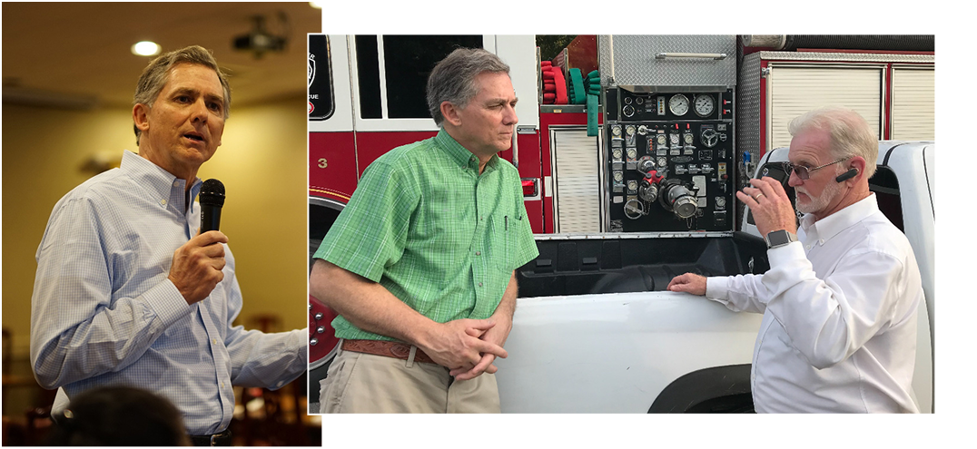 Congressman French Hill speaking into a microphone - Congressman French Hill speaking to a voter in front of a firetruck