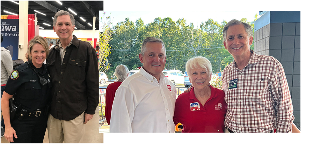 Congressman French Hill with a law enforcement officer - Congressman French Hill smiling with voters at a Republican event